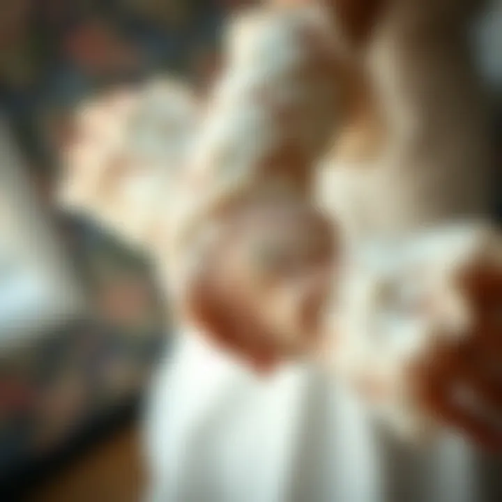 Close-up of intricate lace detailing on elbow length gloves