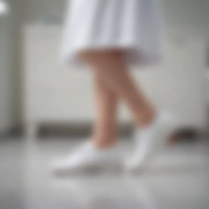 Nurse showcasing all white shoes in a clinical setting