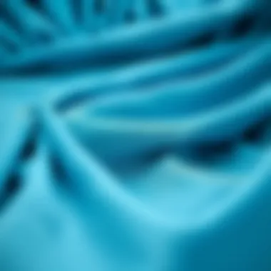 Close-up of the fabric and texture of the aqua blue dress