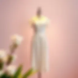 Elegant white summer dress displayed on a mannequin against a soft pastel backdrop