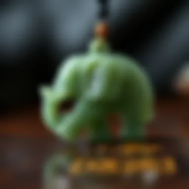 A close-up view of a jade elephant pendant showcasing intricate carvings