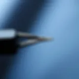 Close-up of a stitch remover tool with a sharp blade