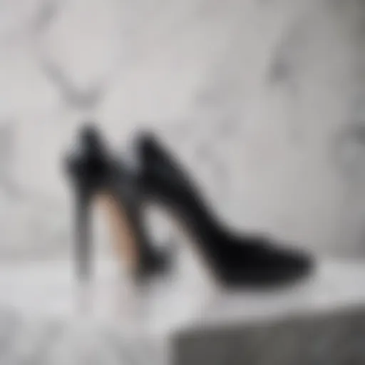 Elegant black snake skin heels on a marble surface