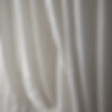 Close-up of the texture and craftsmanship of white crinkle curtains.