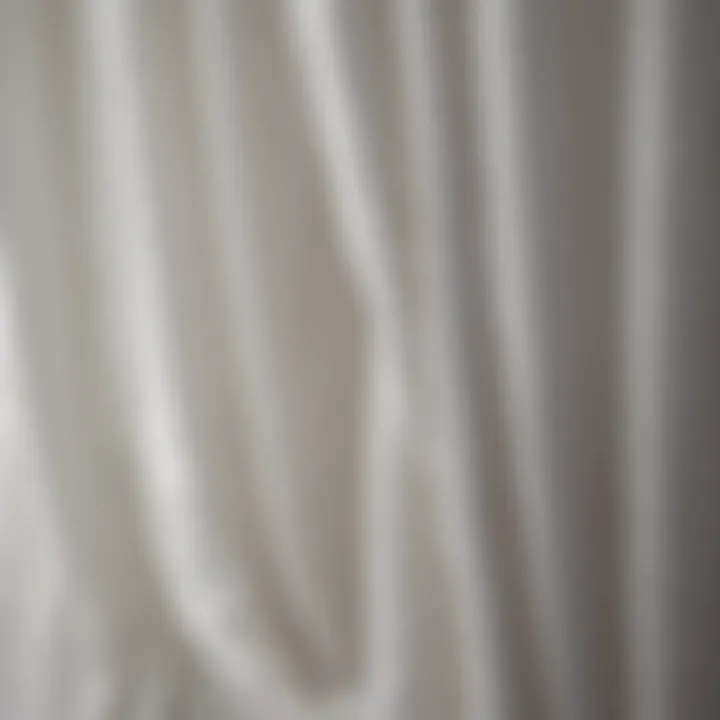 Close-up of the texture and craftsmanship of white crinkle curtains.