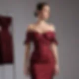 Elegant maroon off the shoulder dress displayed on a mannequin.