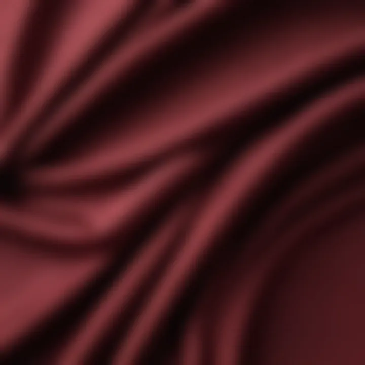 Close-up of maroon fabric showcasing texture and drape.