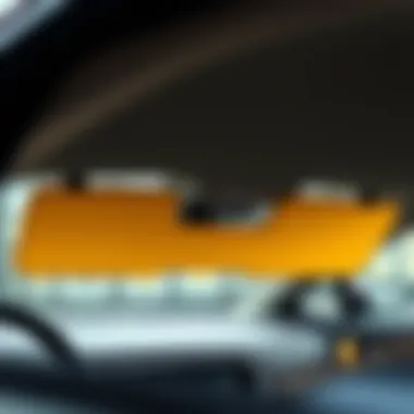 A sleek yellow sun visor installed in a modern car